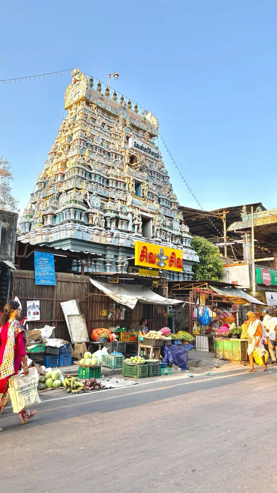 Kapaleeshwarar temple gopuram above a busy Mylapore street market